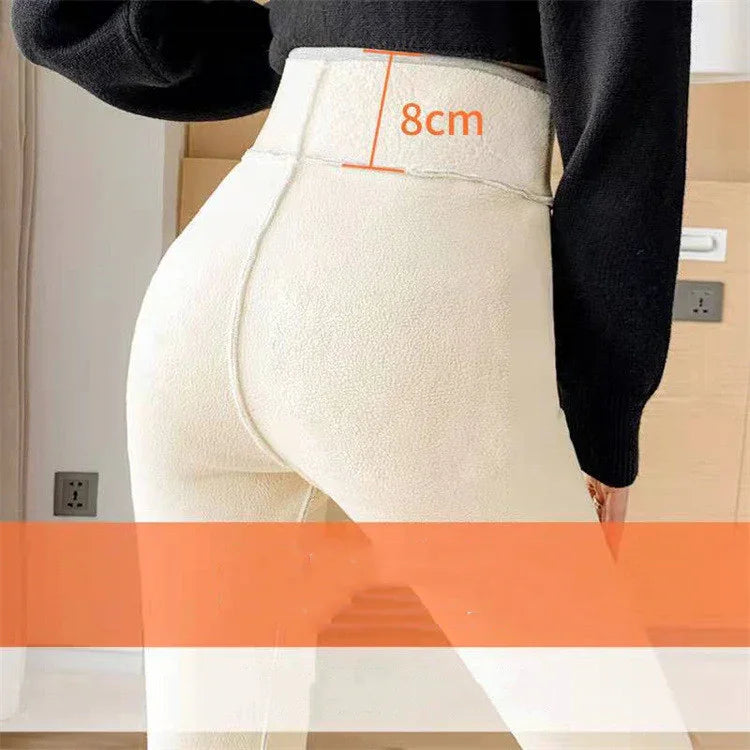 Close-up of person wearing high-waisted cream leggings with 8cm waistband measurement shown
