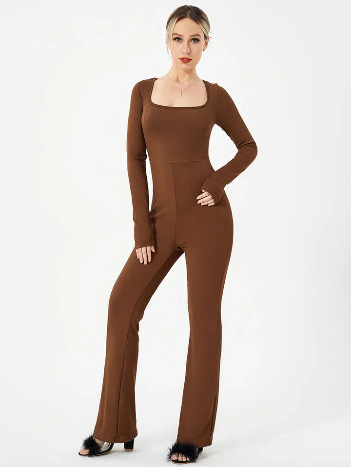 Woman wearing brown long-sleeve square-neck fitted jumpsuit with flared pants and black fur sandals