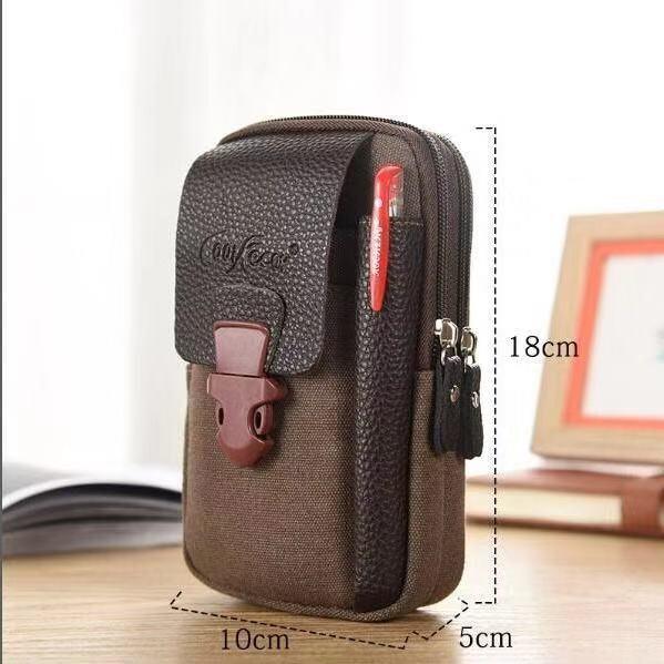 Compact brown canvas and leather travel pouch with front flap, zipper, and pen holder measuring 18x10x5 cm