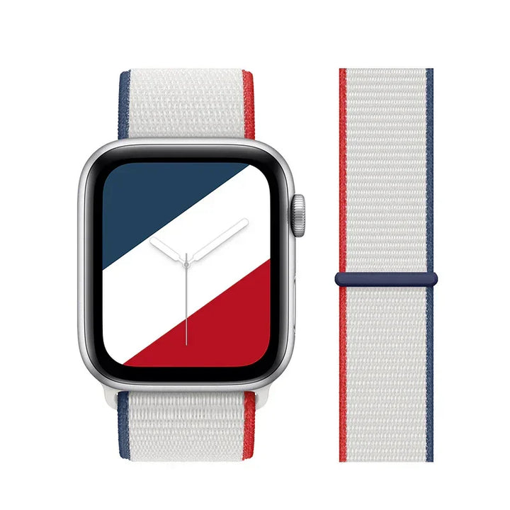 Smartwatch with silver case and white nylon band featuring red and blue stripes, simple analog watch face