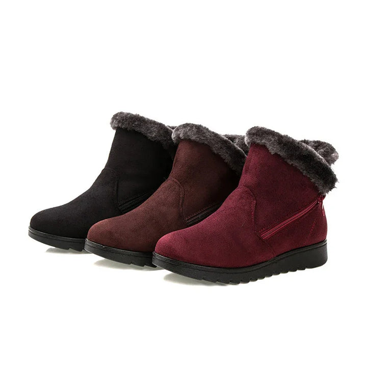 Three pairs of women's winter ankle boots with fur lining in black, brown, and burgundy colors
