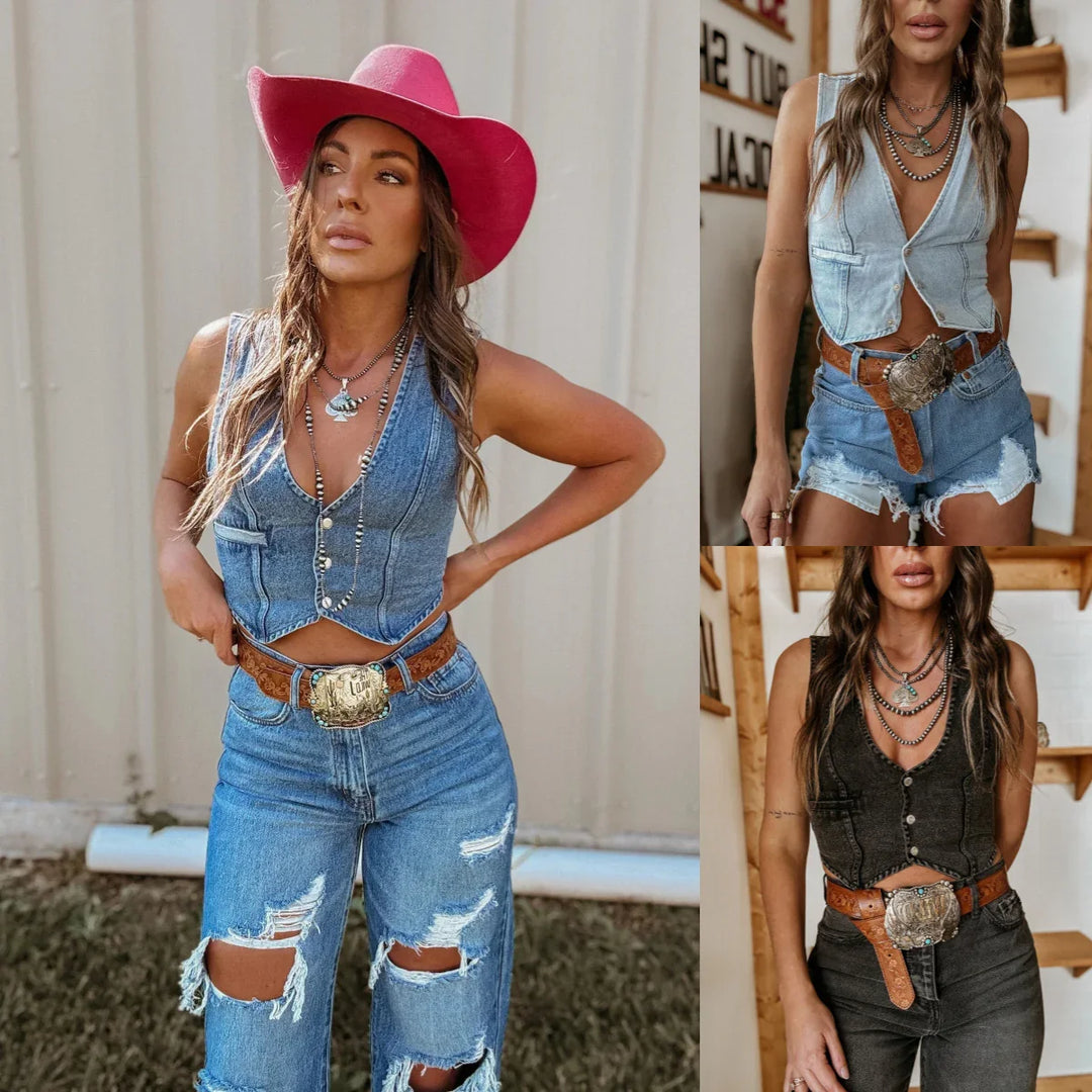 Woman modeling distressed denim vest and jeans with a pink cowboy hat and large belt buckle