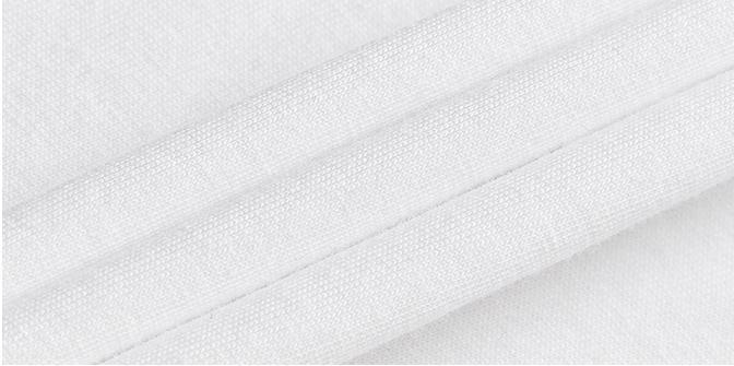 Close-up of clean white cotton fabric with fine weave texture and stitching detail