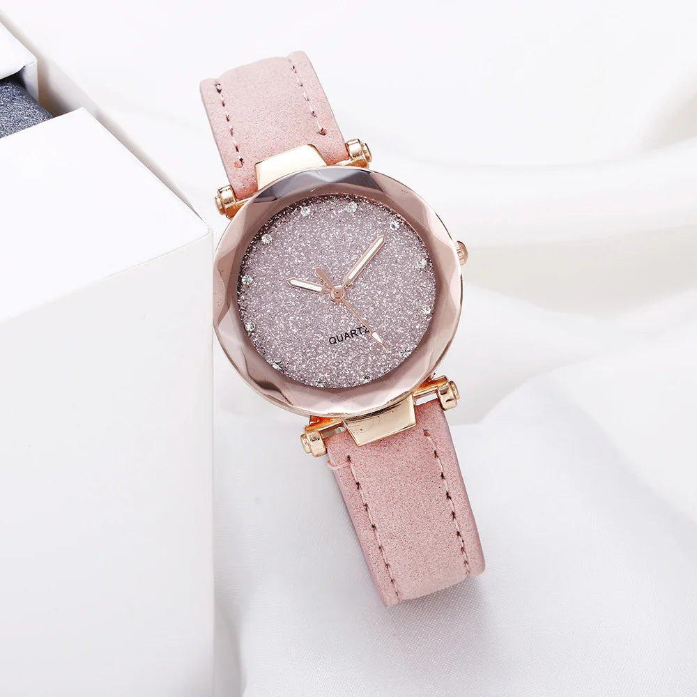 Elegant pink quartz wristwatch with glittery dial, rose gold case, and soft leather strap