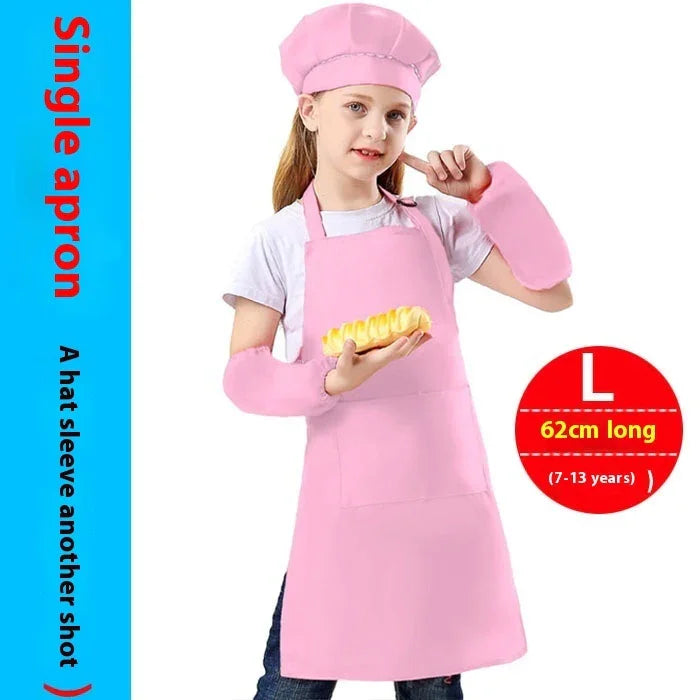 Girl wearing pink chef hat, apron, and arm sleeves holding a bread loaf, kids cooking set