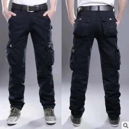 Front and back view of men's black cargo pants with multiple pockets, worn with a black belt and sneakers