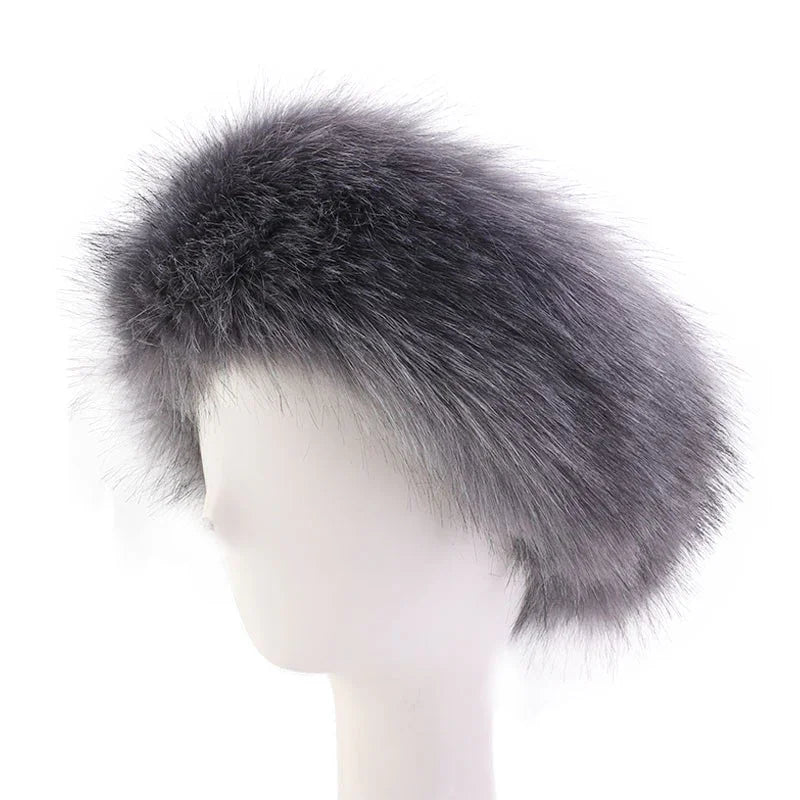 Gray fur beret hat on white mannequin head against white background