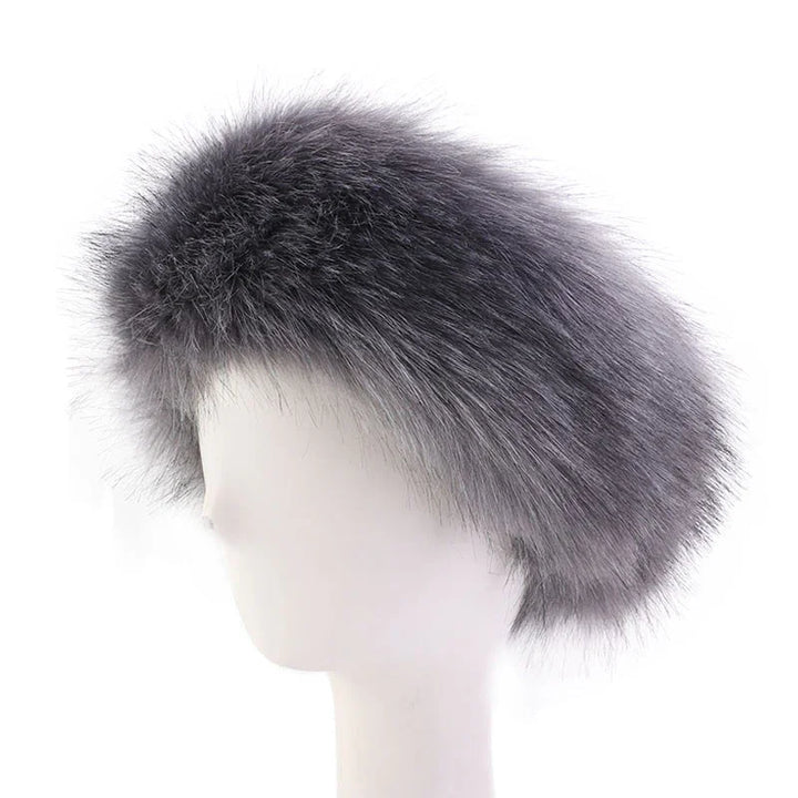 Gray fur beret hat on white mannequin head against white background
