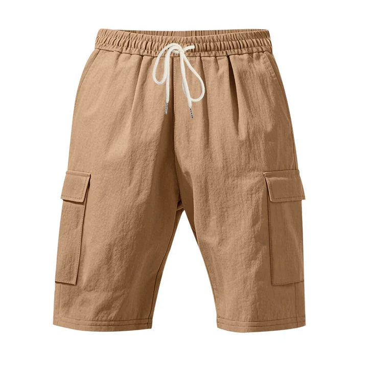 Beige casual cargo shorts with elastic waistband and white drawstring on white background