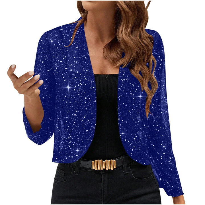 Woman wearing a dark blue starry patterned open-front blazer with black top and black pants