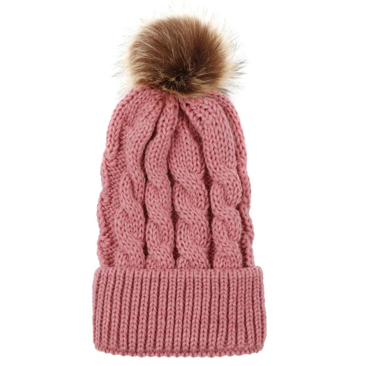 Pink cable knit winter beanie hat with a brown faux fur pompom on top