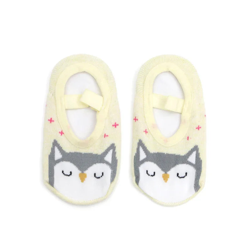 Yellow baby socks with cute sleeping owl face design and soft elastic straps