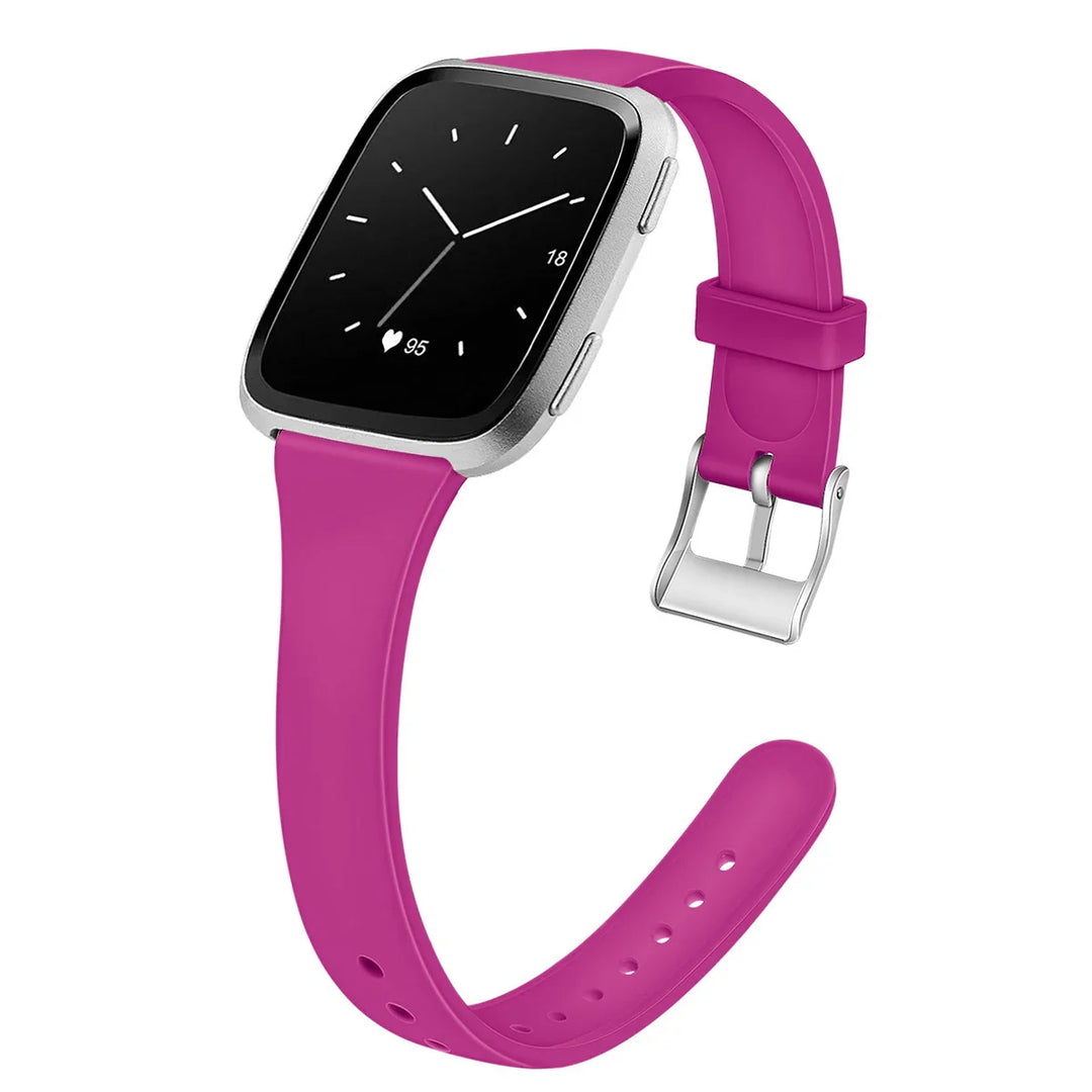 Silver smartwatch with a black screen and a heart rate of 95, featuring a vibrant pink silicone strap