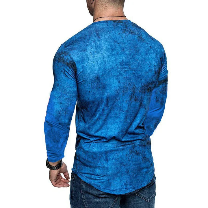 Man wearing blue long sleeve shirt with black watch and dark jeans, back view