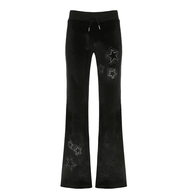 Black velvet flare pants with studded star embellishments and drawstring waist