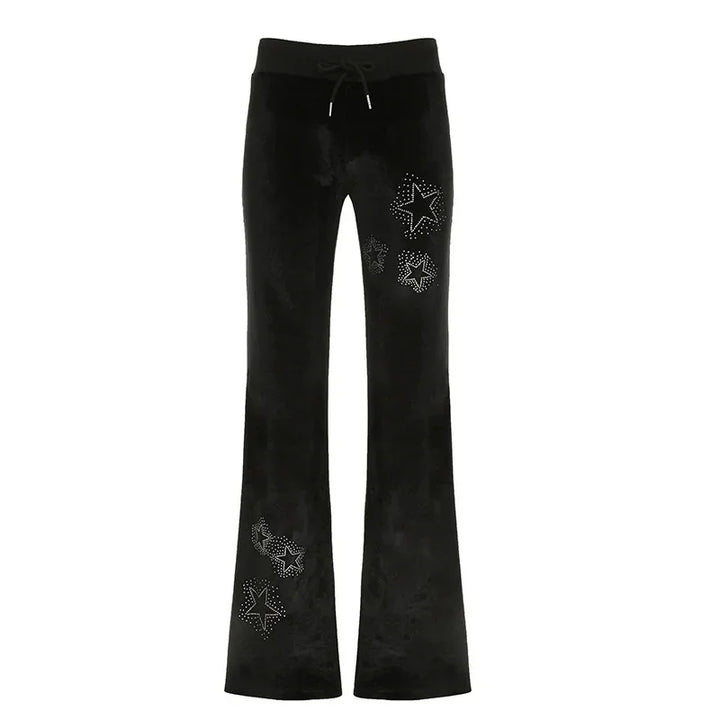 Black velvet flare pants with studded star embellishments and drawstring waist