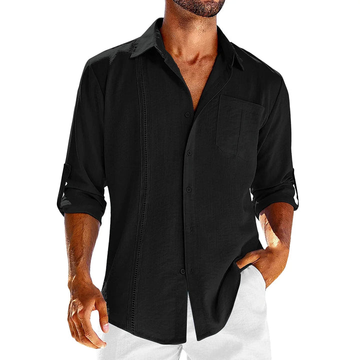 man wearing black button-up linen shirt with rolled sleeves and chest pocket
