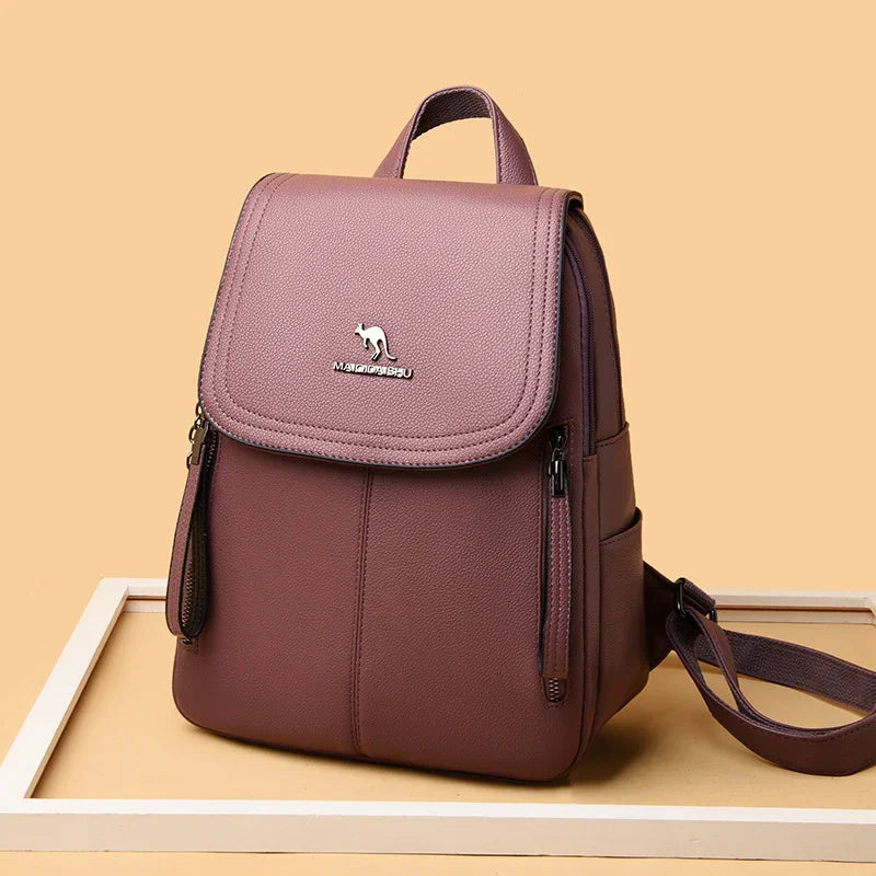 stylish mauve leather backpack with kangaroo logo, front zipper pockets, and adjustable straps