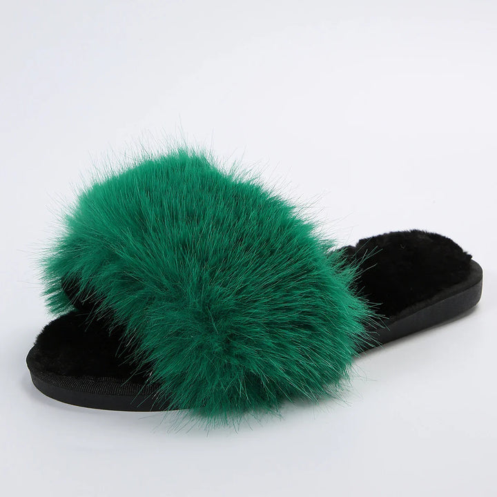 black slide slipper with fluffy dark green faux fur strap on white background