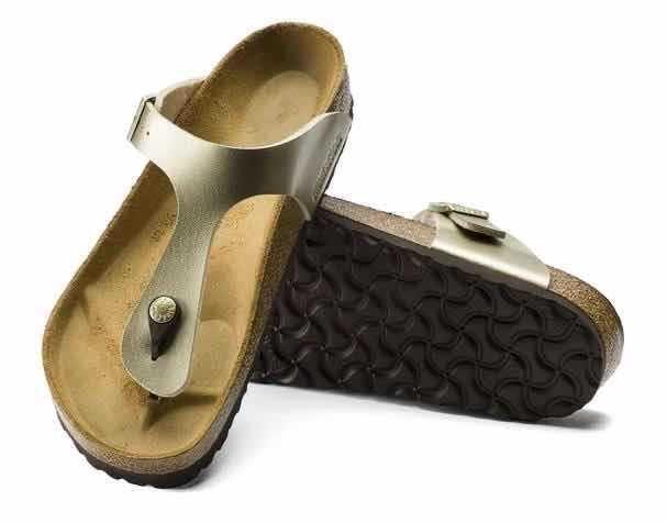 gold metallic thong sandals with adjustable strap and cork footbed featuring black textured sole