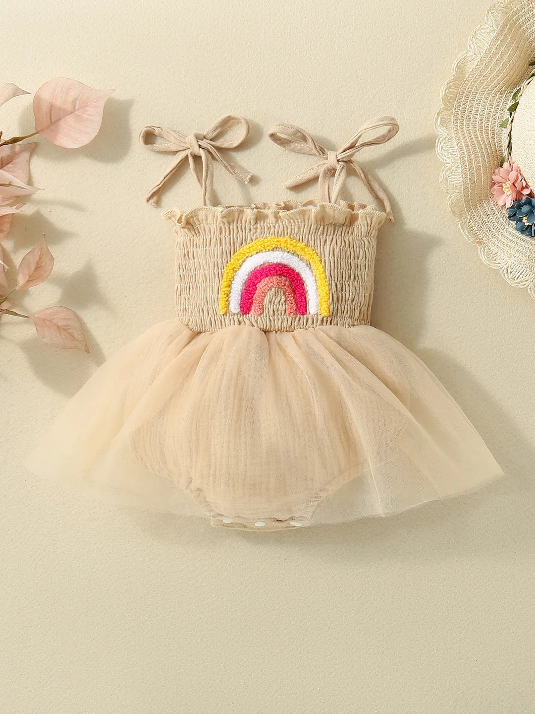 Beige baby girl romper dress with tulle skirt and colorful rainbow embroidery on chest