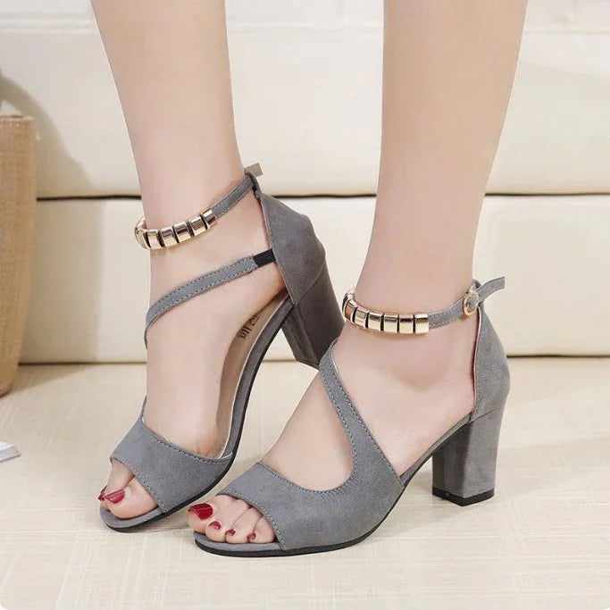 Women's gray suede block heel sandals with gold accent ankle straps and open toes