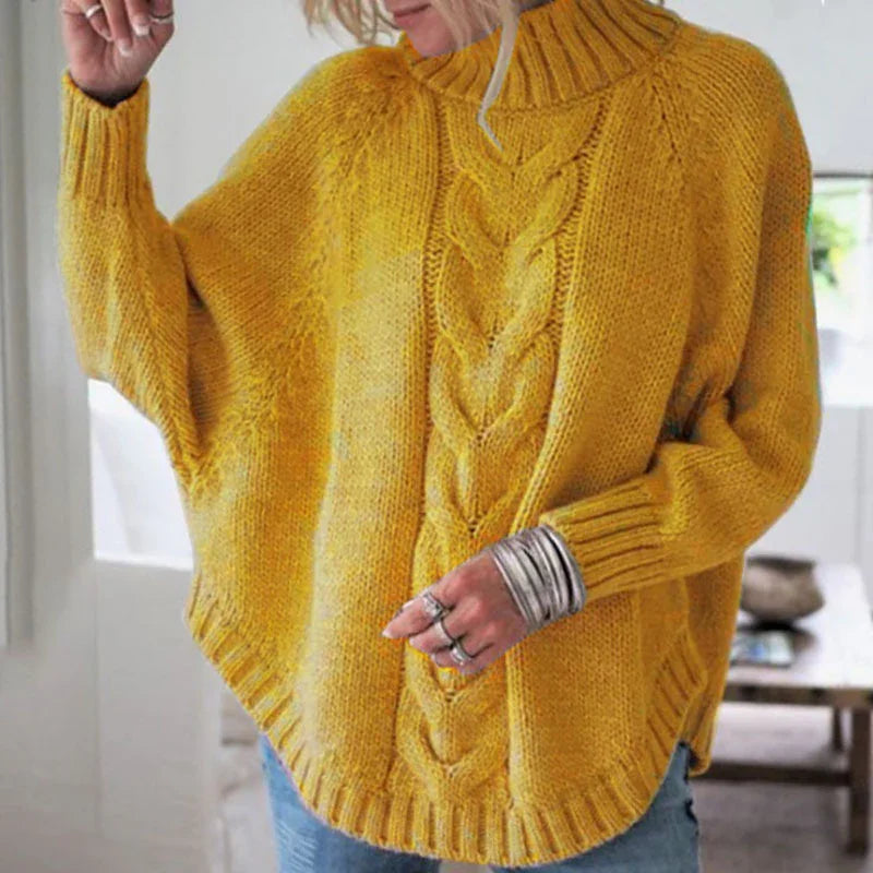 Woman wearing mustard yellow cable knit turtleneck sweater with ribbed cuffs and hem