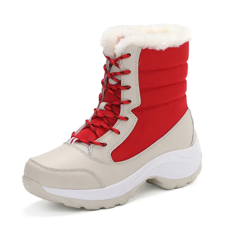 Red and beige winter boot with red laces and white fur lining, sturdy sole for cold weather