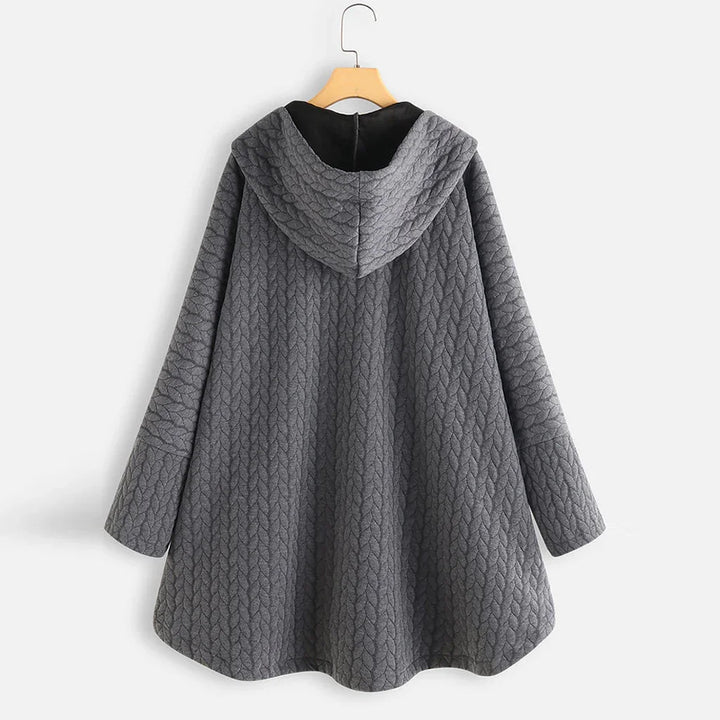 back view of gray quilted hooded jacket with long sleeves on wooden hanger