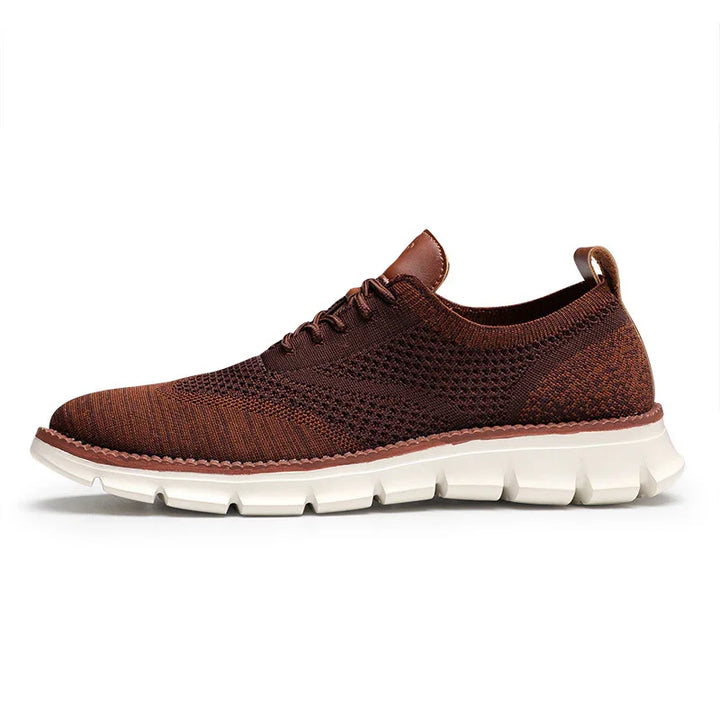 Brown knit lace-up sneaker with cushioned white sole, breathable textile upper, and pull tab heel