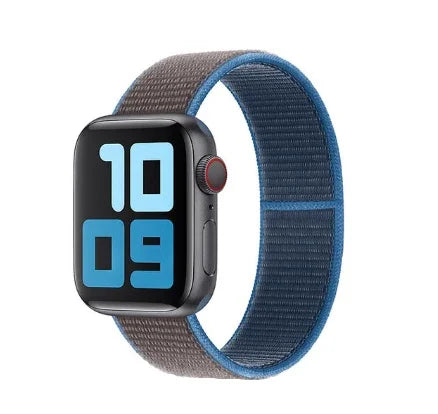 Smartwatch with black case and blue-gray nylon sport loop band showing digital time 10:09