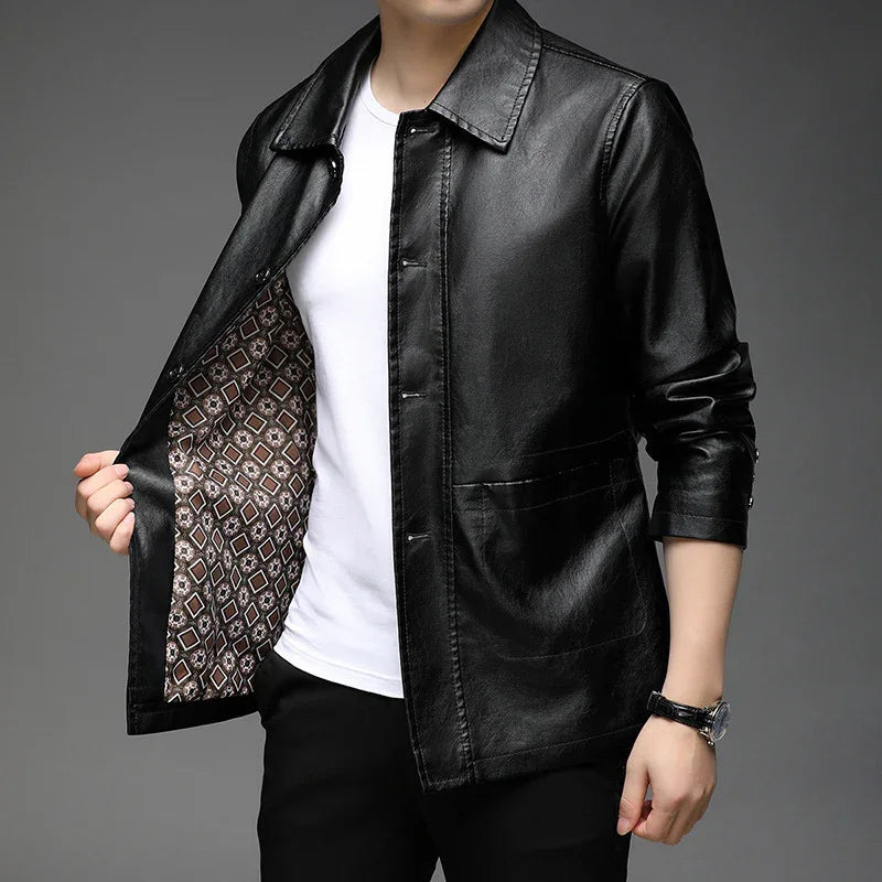 Man wearing sleek black leather jacket with patterned inner lining over white shirt and black pants
