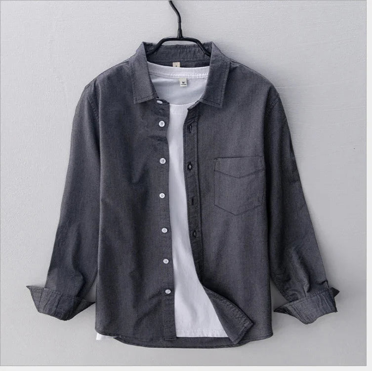 Dark gray button-up shirt layered over white crew neck t-shirt on black hanger