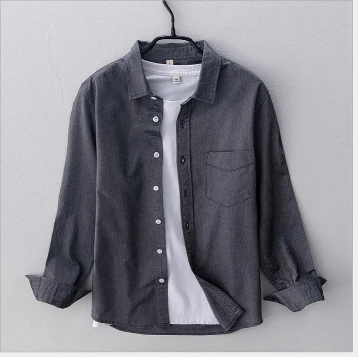 Dark gray button-up shirt layered over white crew neck t-shirt on black hanger