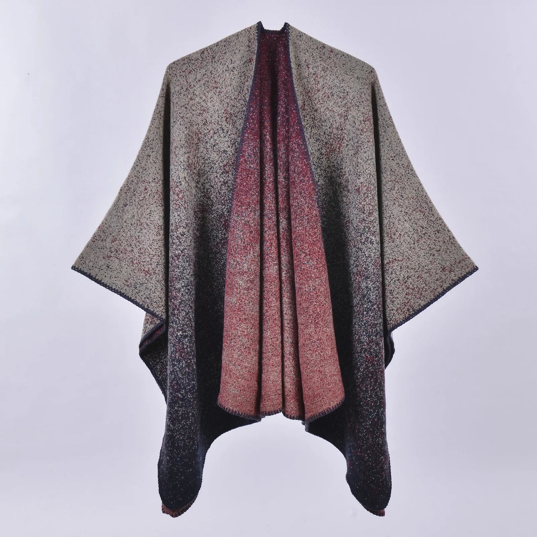 Gradient knit poncho with wide sleeves in beige, black, and red hues on white background