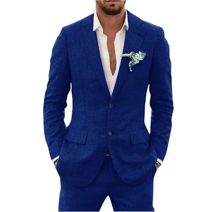 Man wearing royal blue suit with white shirt and floral boutonniere on lapel