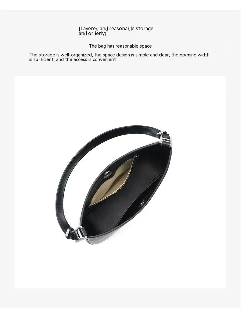 Top view of black leather handbag showing organized interior with zippered and open compartments