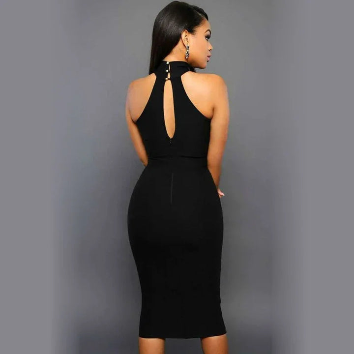 Woman wearing a form-fitting black midi dress with a high neckline and back keyhole detail