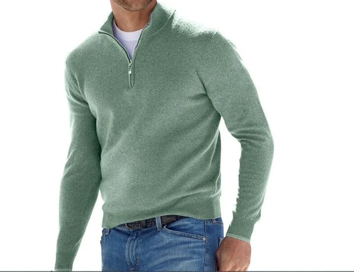 Men's light green quarter-zip pullover sweater worn with blue jeans