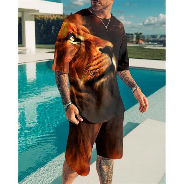 Man wearing bold lion face print black t-shirt and matching shorts by a swimming pool in sunny outdoor setting