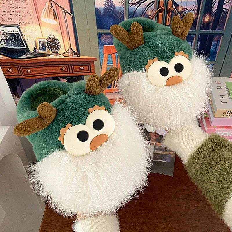 Green plush slippers with cartoon reindeer faces and white fluffy beards on wooden table