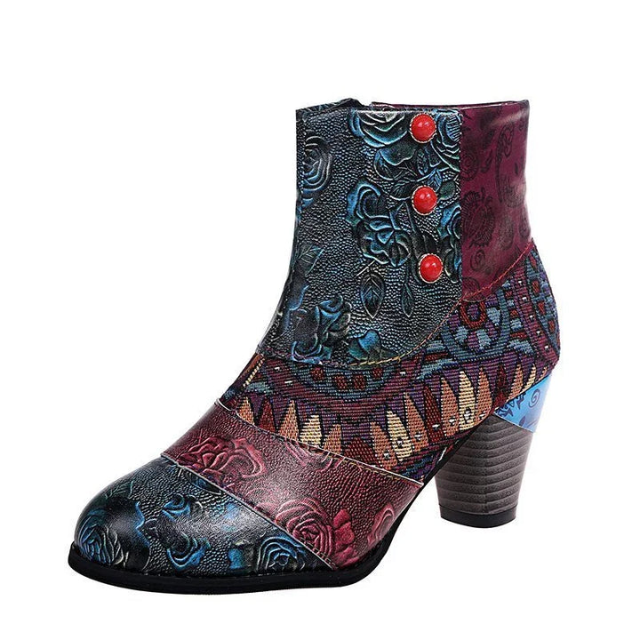 Colorful leather ankle boot with floral embossing, geometric fabric, red buttons, and stacked heel