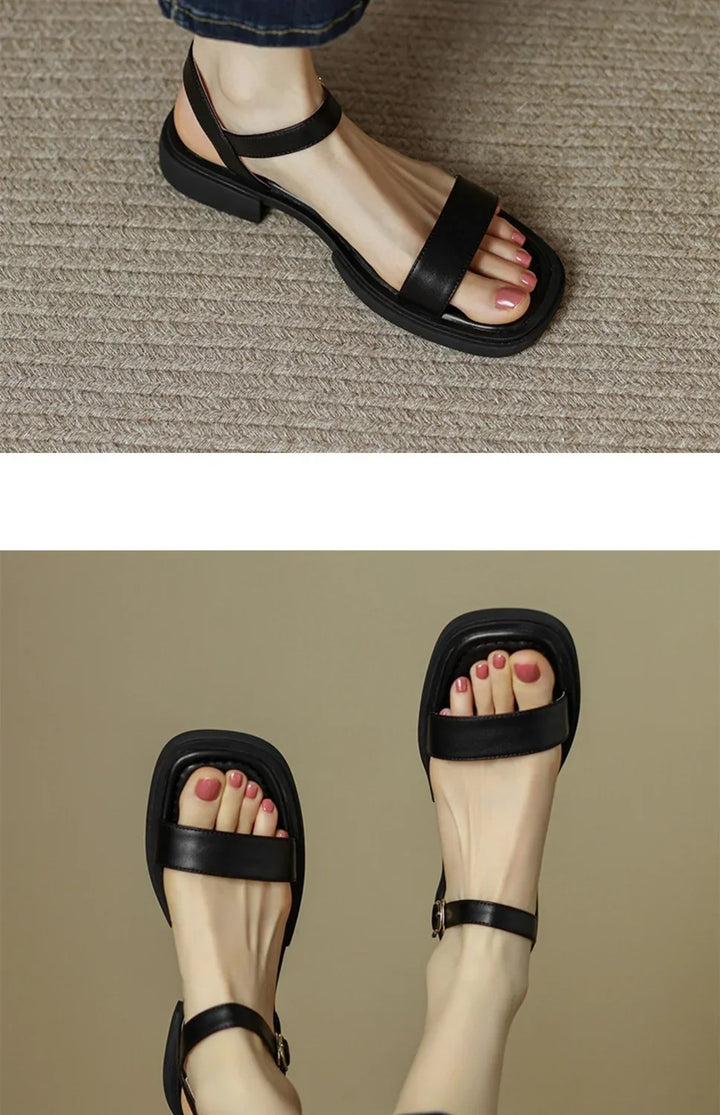Black leather open-toe ankle strap sandals with square toe design and pink painted toenails