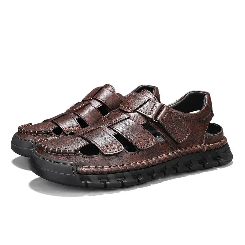 Brown leather men's fisherman sandals with black rugged rubber soles and hook-and-loop straps