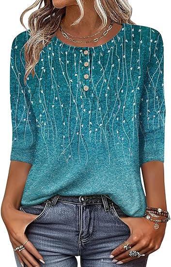 Woman wearing blue 3/4 sleeve blouse with vertical floral patterns and button details, paired with jeans