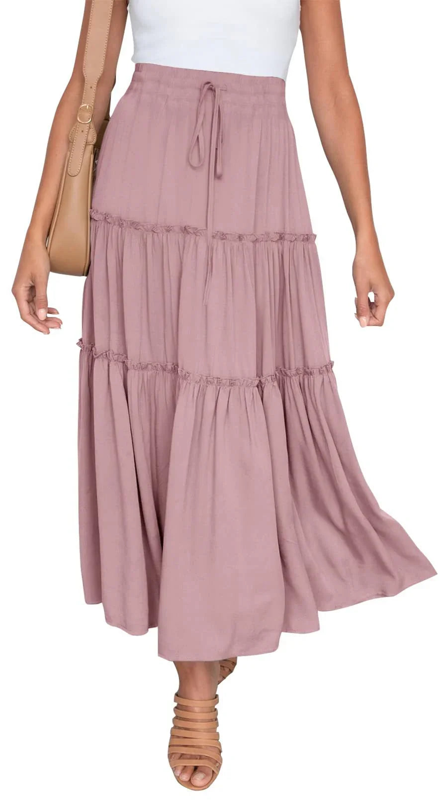 Woman wearing a mauve tiered maxi skirt with drawstring waist and tan strappy sandals