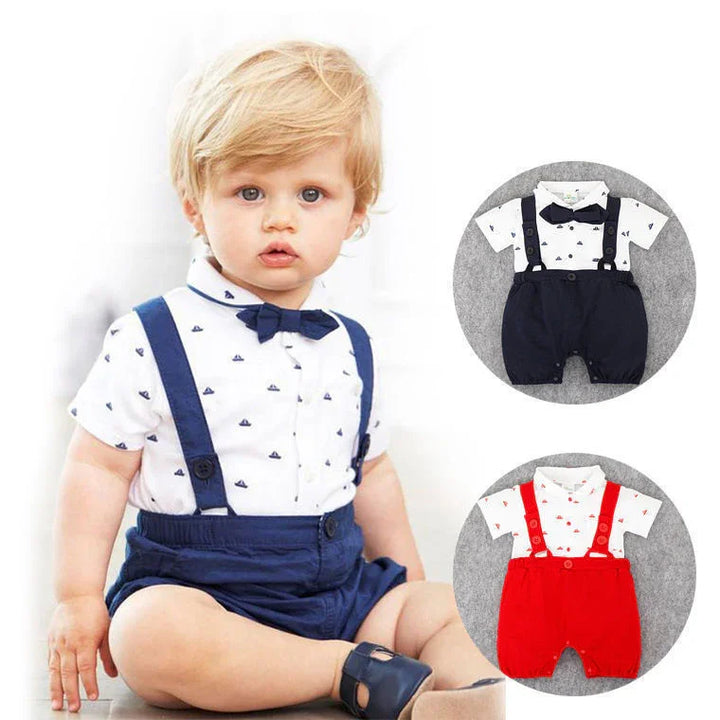 Blond toddler wearing a white shirt with navy blue boat prints, navy suspenders, bow tie, and shorts, shown with additional red and navy outfit options