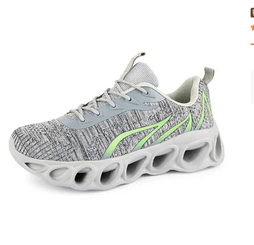gray and white knit athletic sneaker with futuristic hollowed sole and green accents
