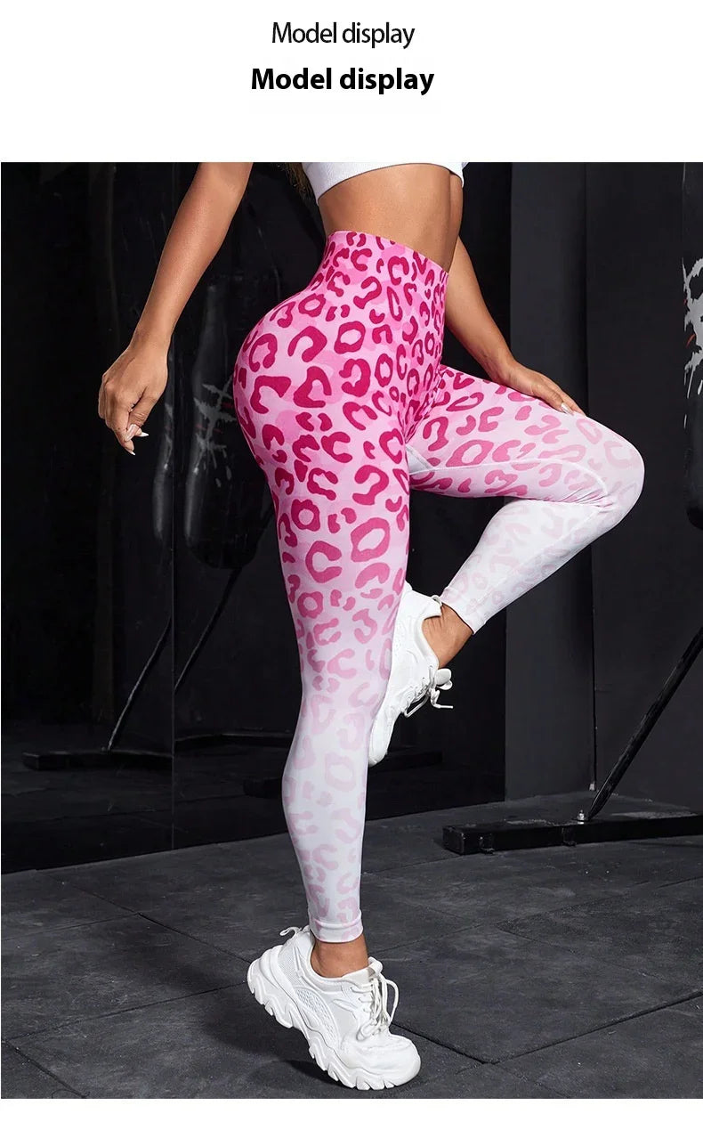 Woman wearing pink and white leopard print leggings and white chunky sneakers in gym setting