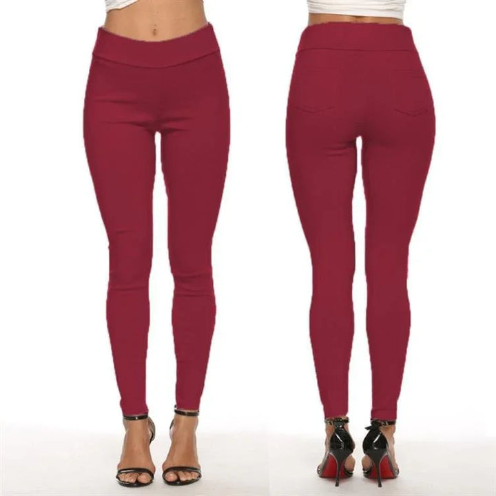 Front and back view of woman wearing wine red high-waisted skinny pants with black high heel sandals
